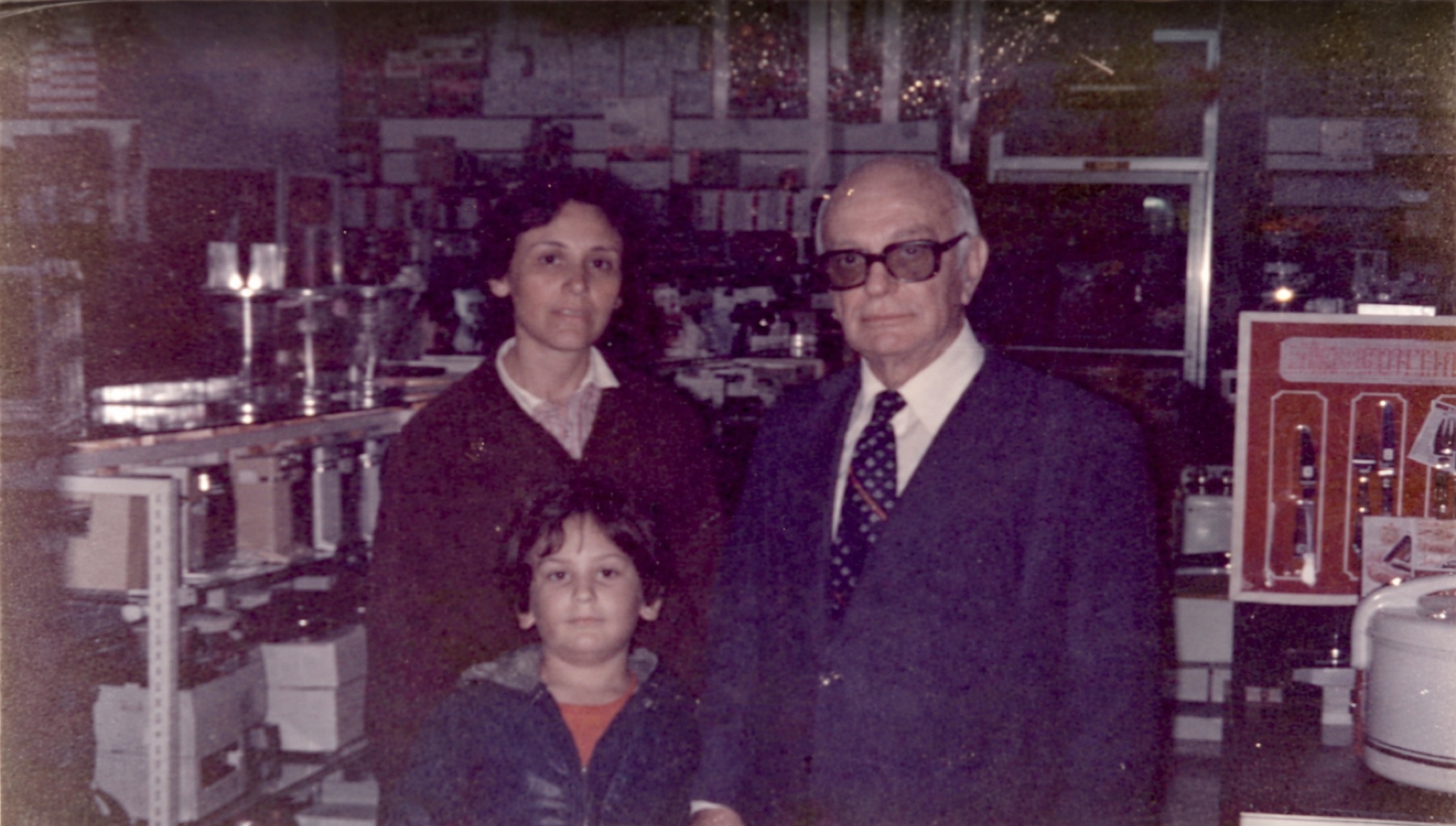 Yossi with his mother and father in the family shop